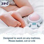Baby feet with Zed on mattress